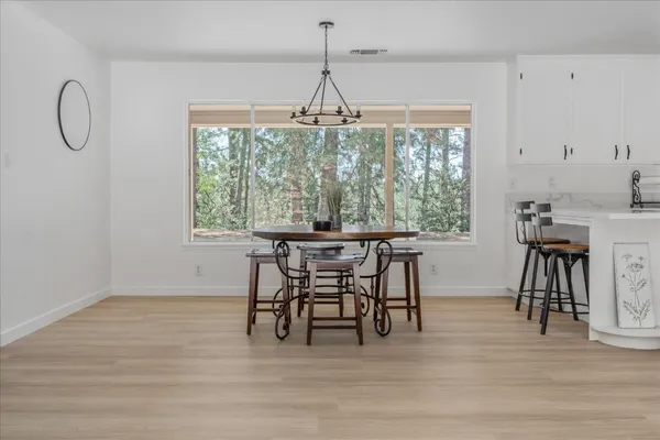 a view of a livingroom with furniture and a window