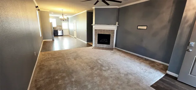 a view of a hallway with a kitchen