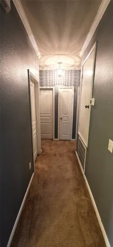 a view of empty room with a fireplace