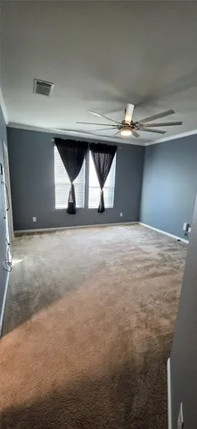 an empty room with a bathroom and a bathroom