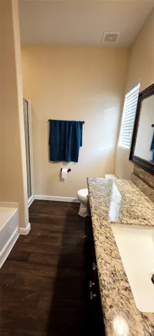 a bathroom with a glass shower door