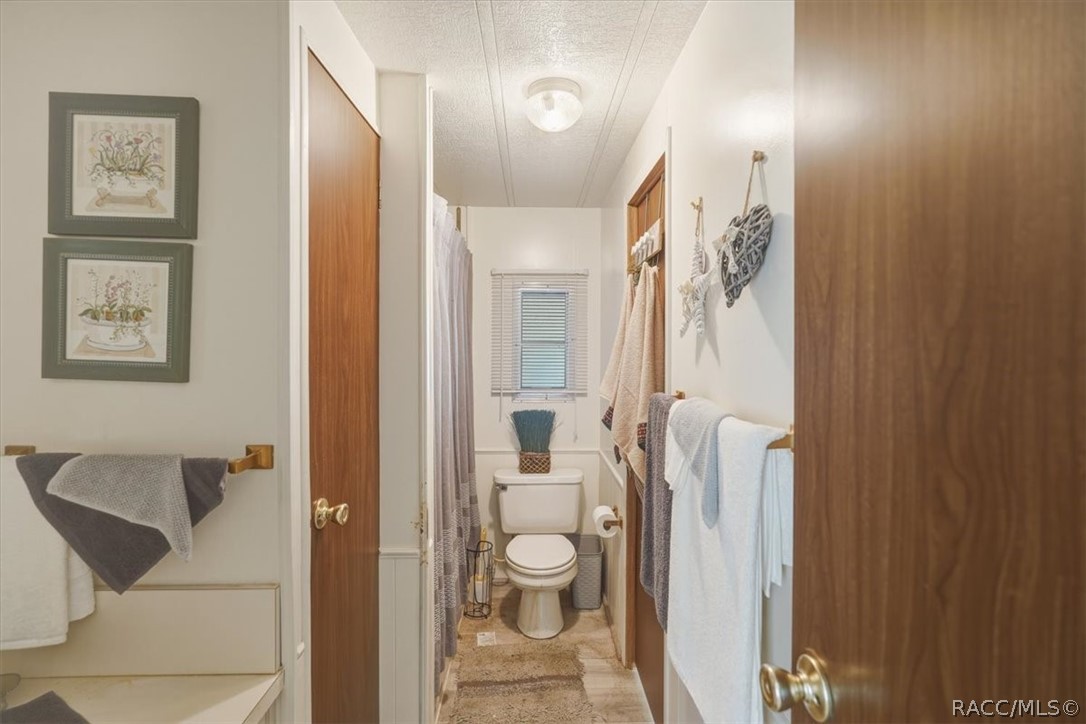 928 South Shad Terrace Inverness, FL 34450 - Photo 24 of 48 a bathroom with a toilet sink and shower