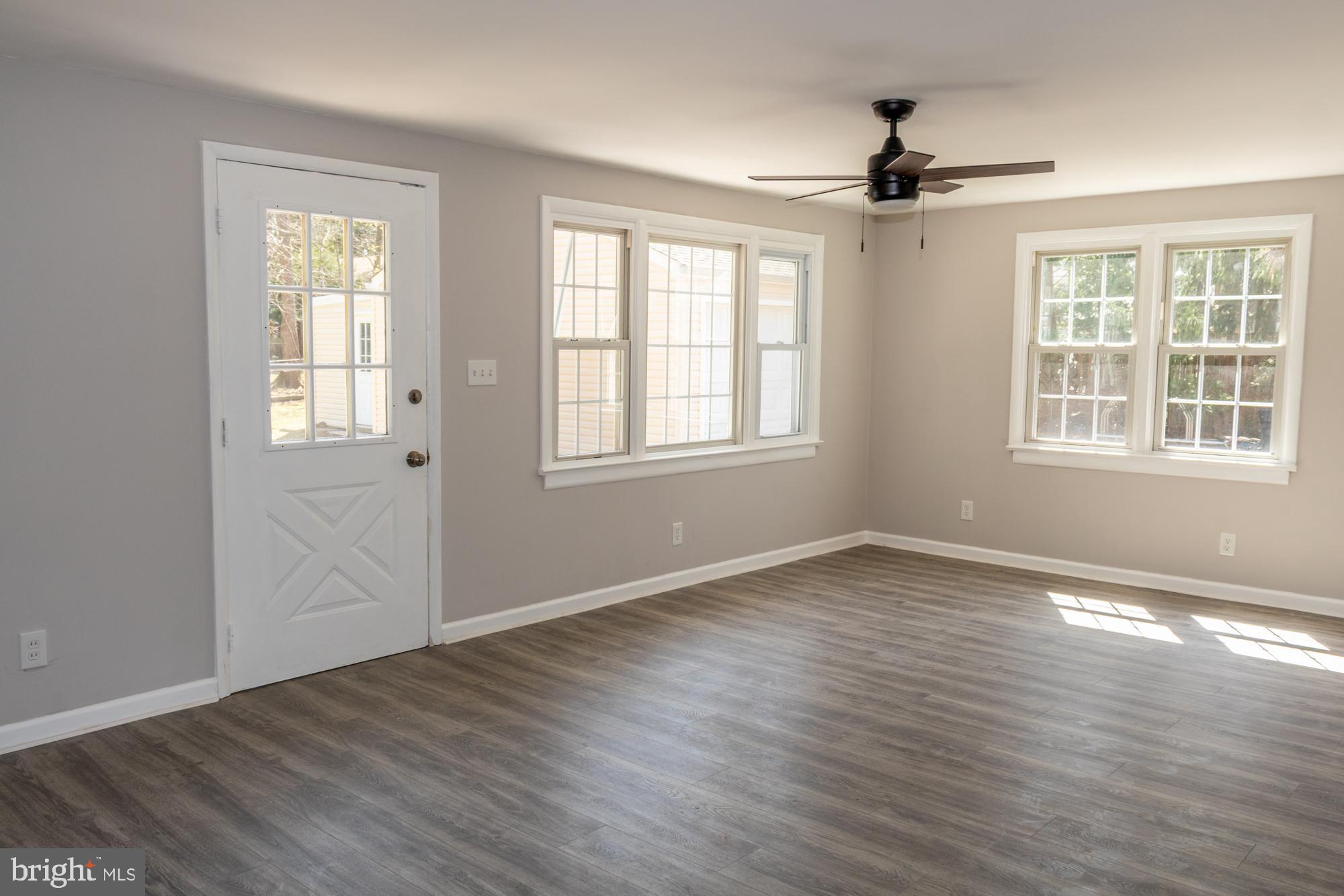 26 Byron Avenue Hamilton, NJ 08610 - Photo 17 of 33 a view of an empty room with wooden floor and a window
