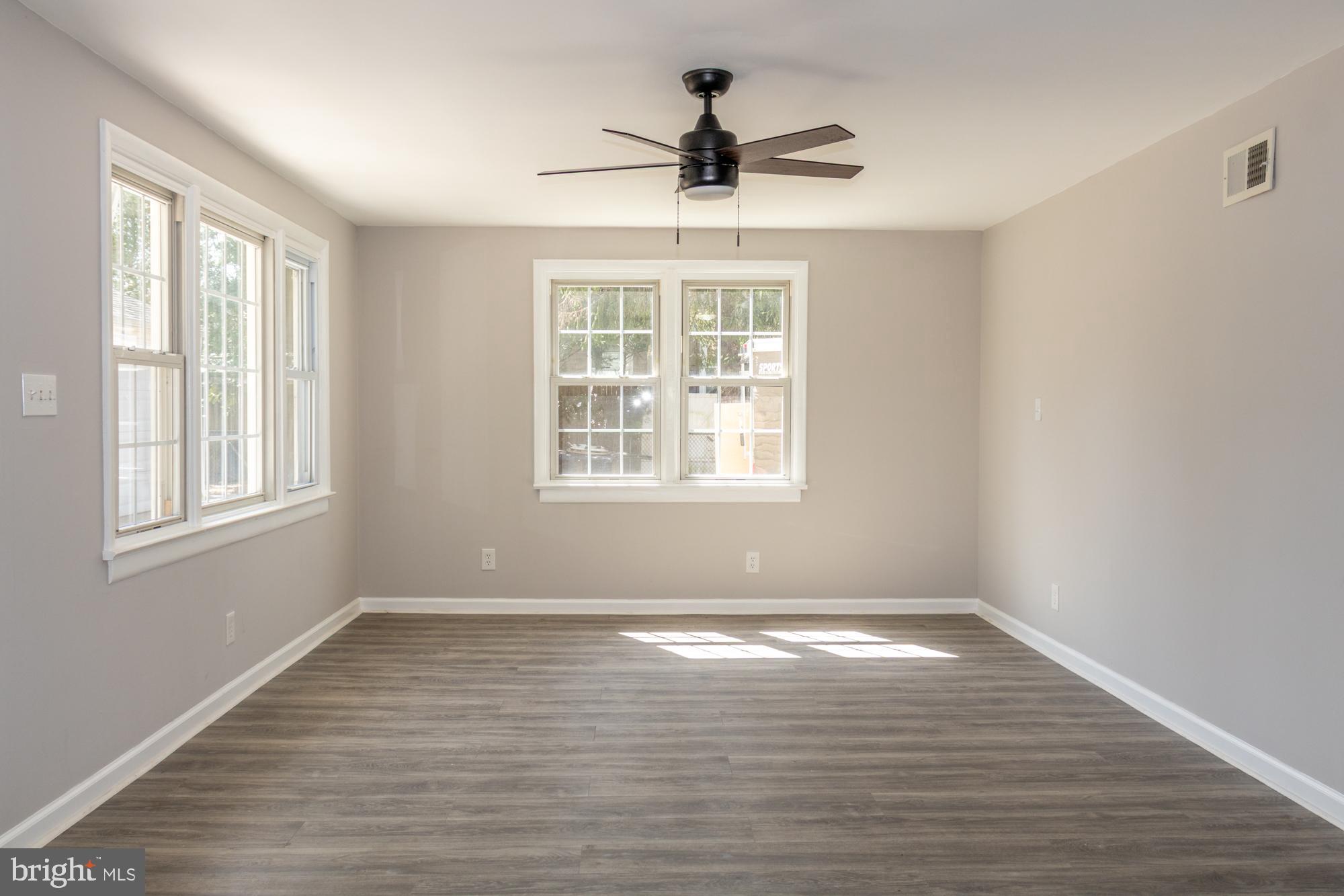 26 Byron Avenue Hamilton, NJ 08610 - Photo 18 of 33 a view of empty room with wooden floor and fan