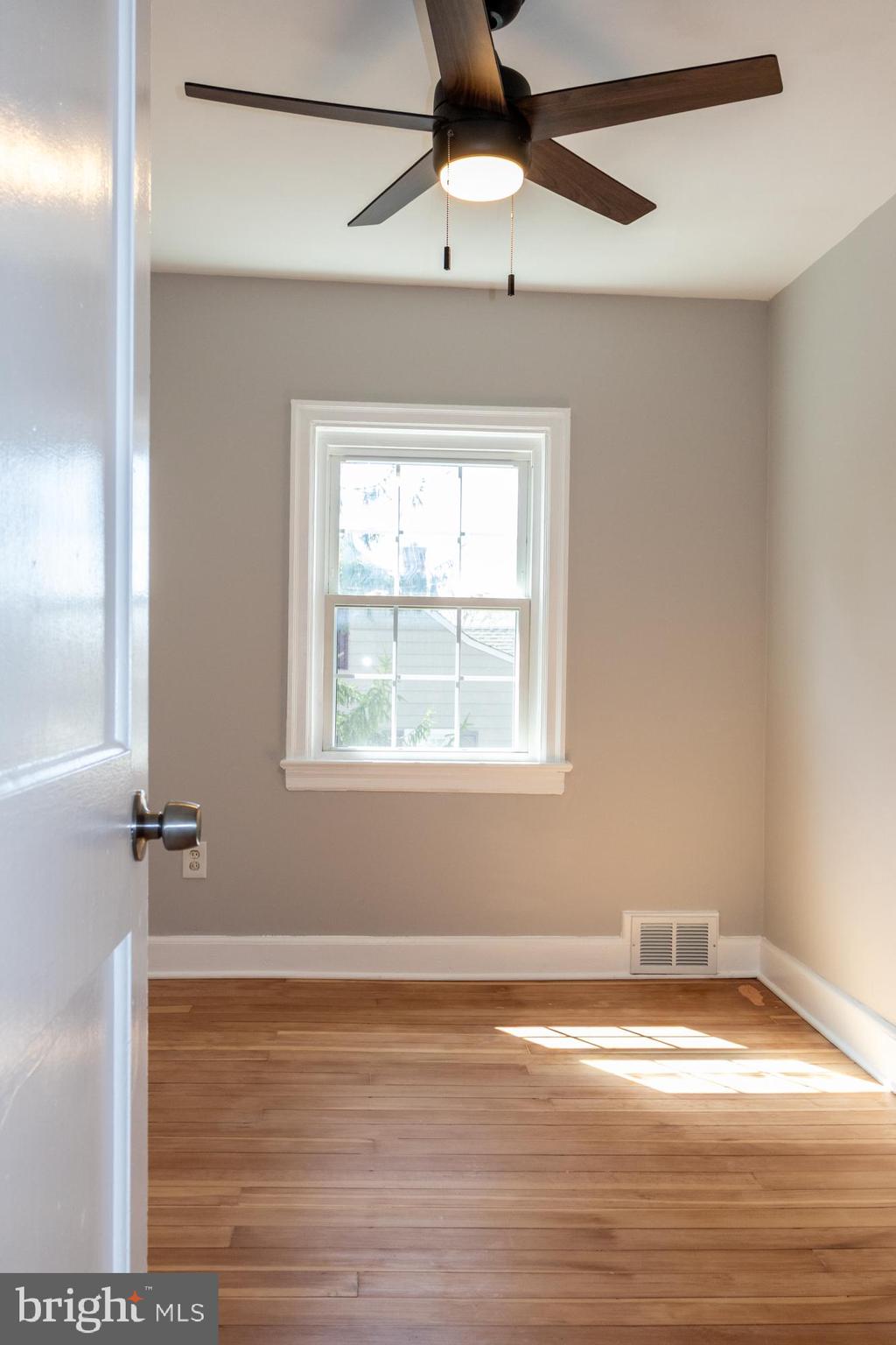 26 Byron Avenue Hamilton, NJ 08610 - Photo 22 of 33 a view of empty room with wooden floor and fan