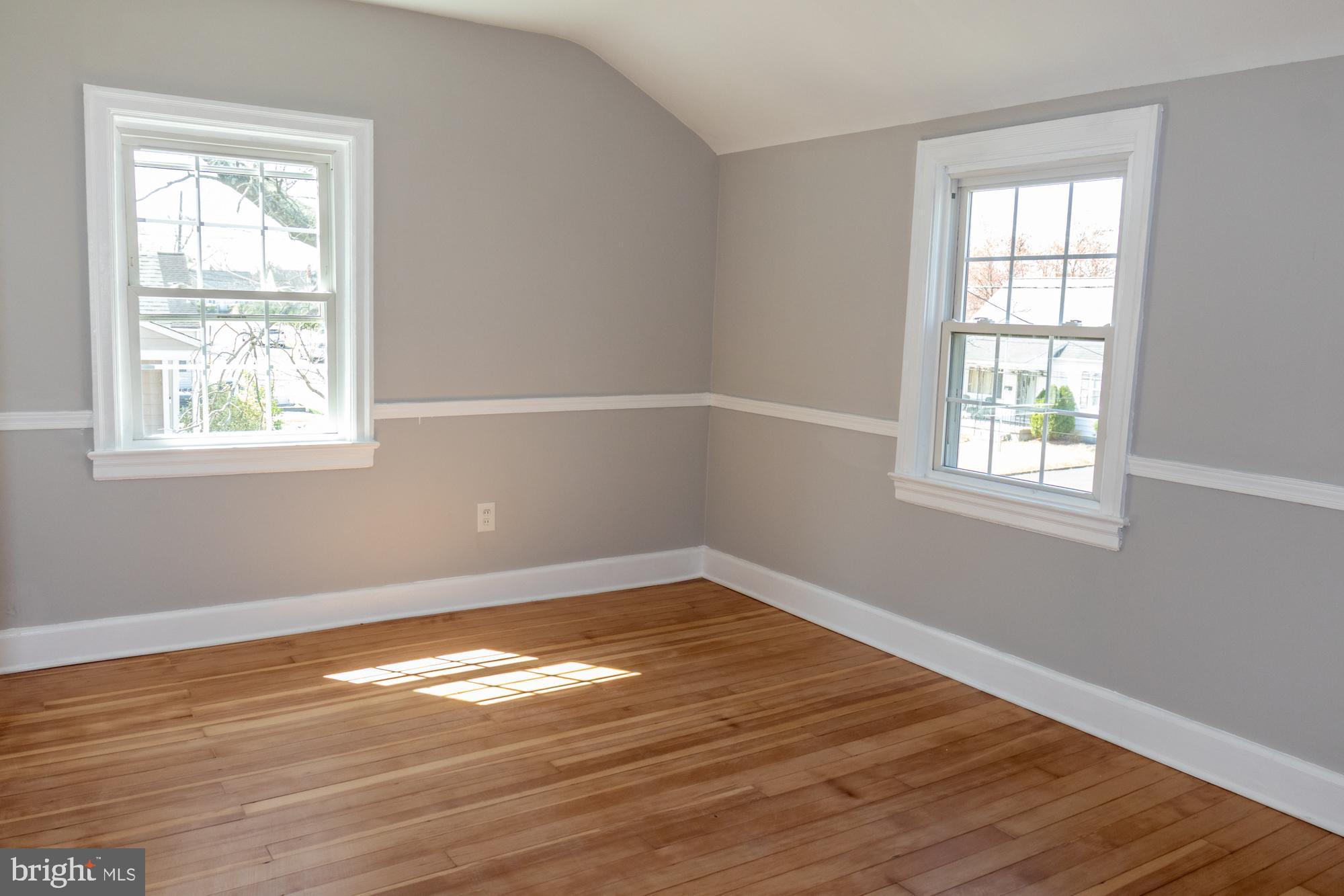 26 Byron Avenue Hamilton, NJ 08610 - Photo 23 of 33 an empty room with wooden floor and windows