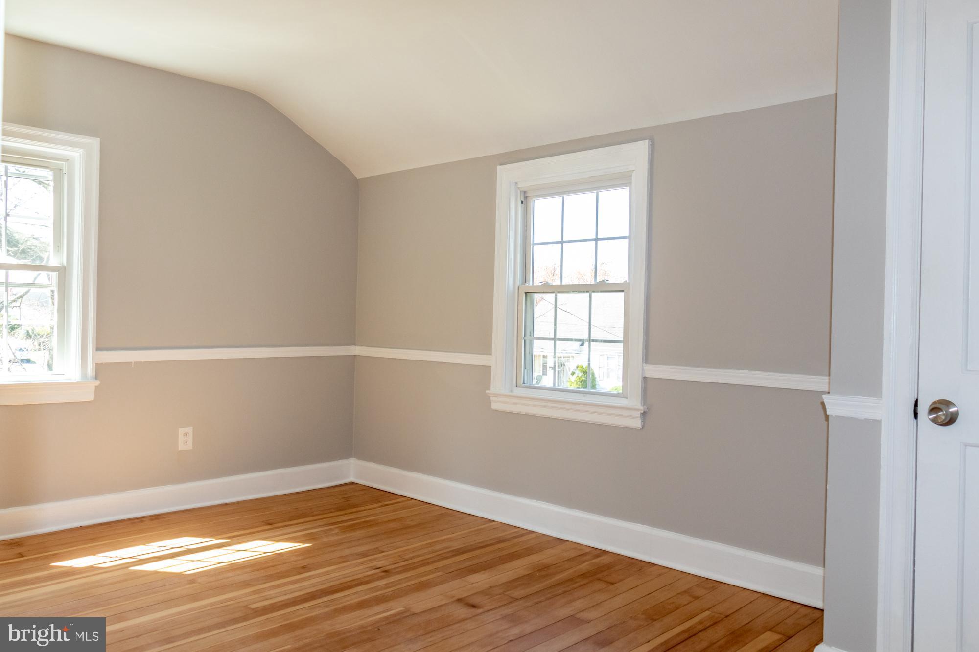 26 Byron Avenue Hamilton, NJ 08610 - Photo 24 of 33 a view of an empty room with wooden floor and a window