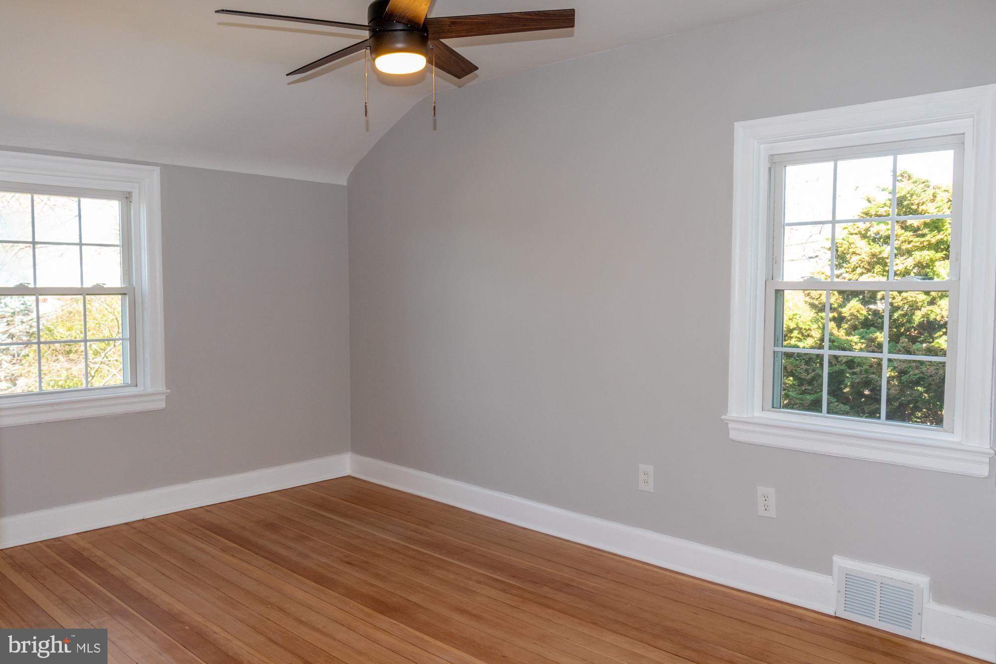 26 Byron Avenue Hamilton, NJ 08610 - Photo 25 of 33 a view of a room with wooden floor and windows
