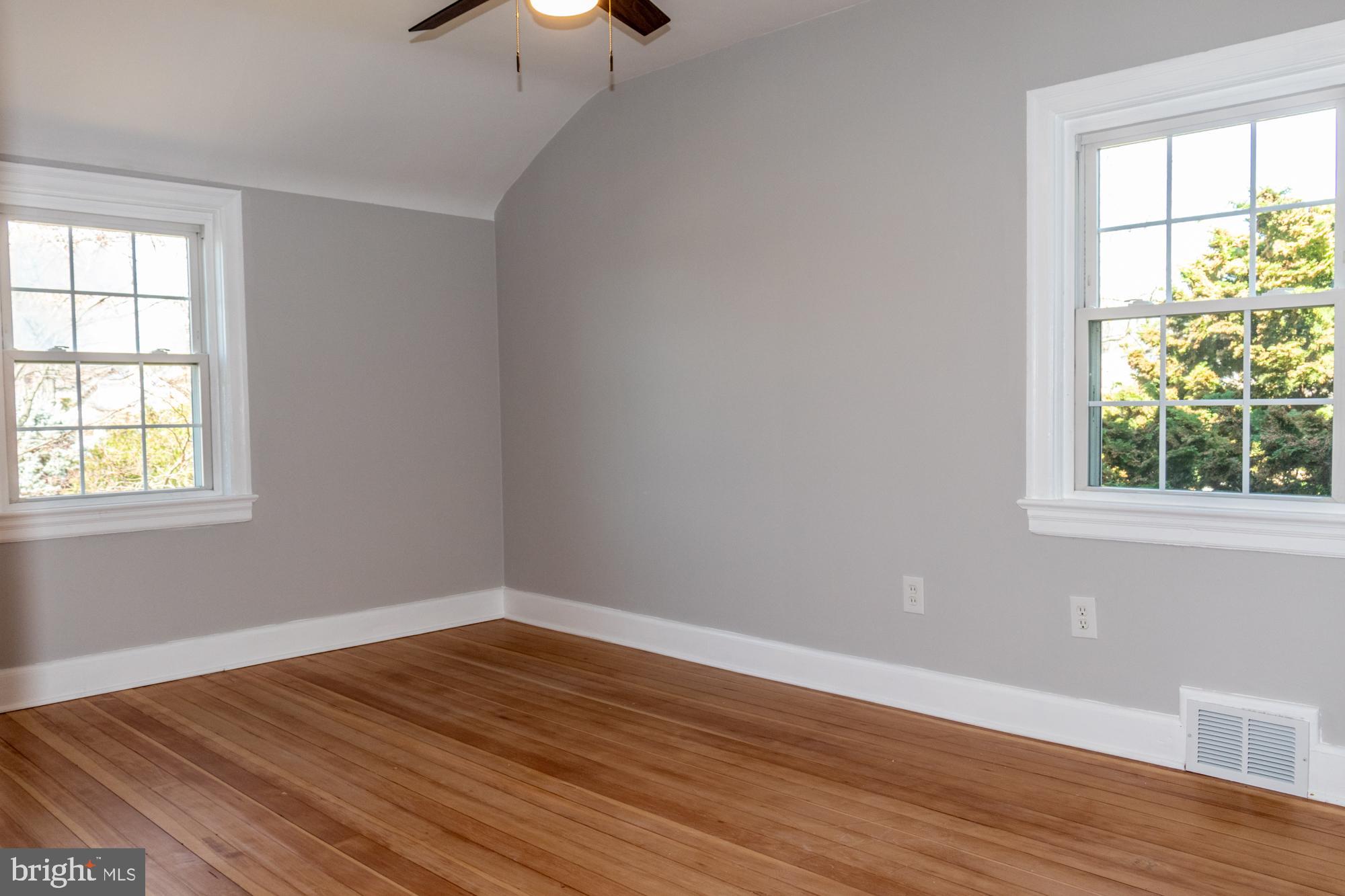 26 Byron Avenue Hamilton, NJ 08610 - Photo 27 of 33 a view of an empty room with wooden floor and a window