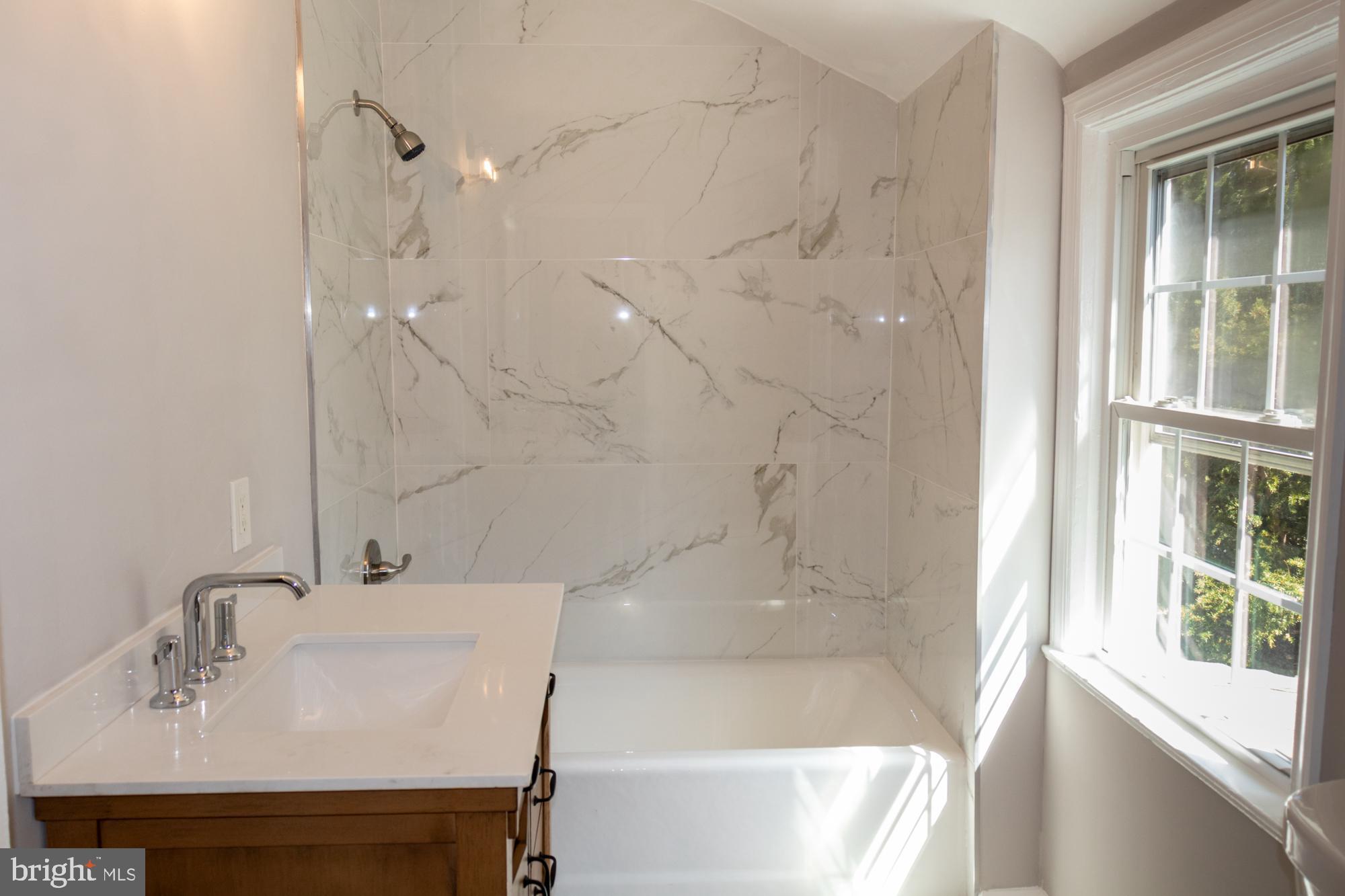 26 Byron Avenue Hamilton, NJ 08610 - Photo 28 of 33 a bathroom with a bathtub and a sink