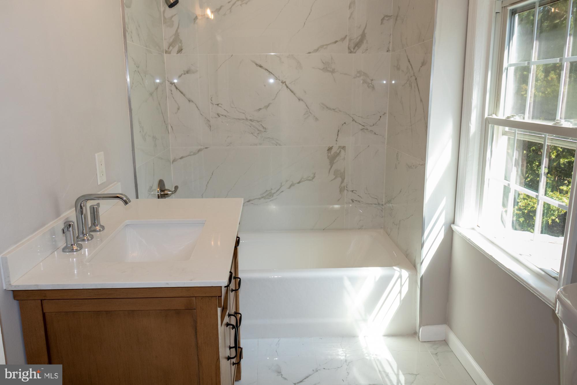 26 Byron Avenue Hamilton, NJ 08610 - Photo 29 of 33 a bathroom with a sink and a bathtub