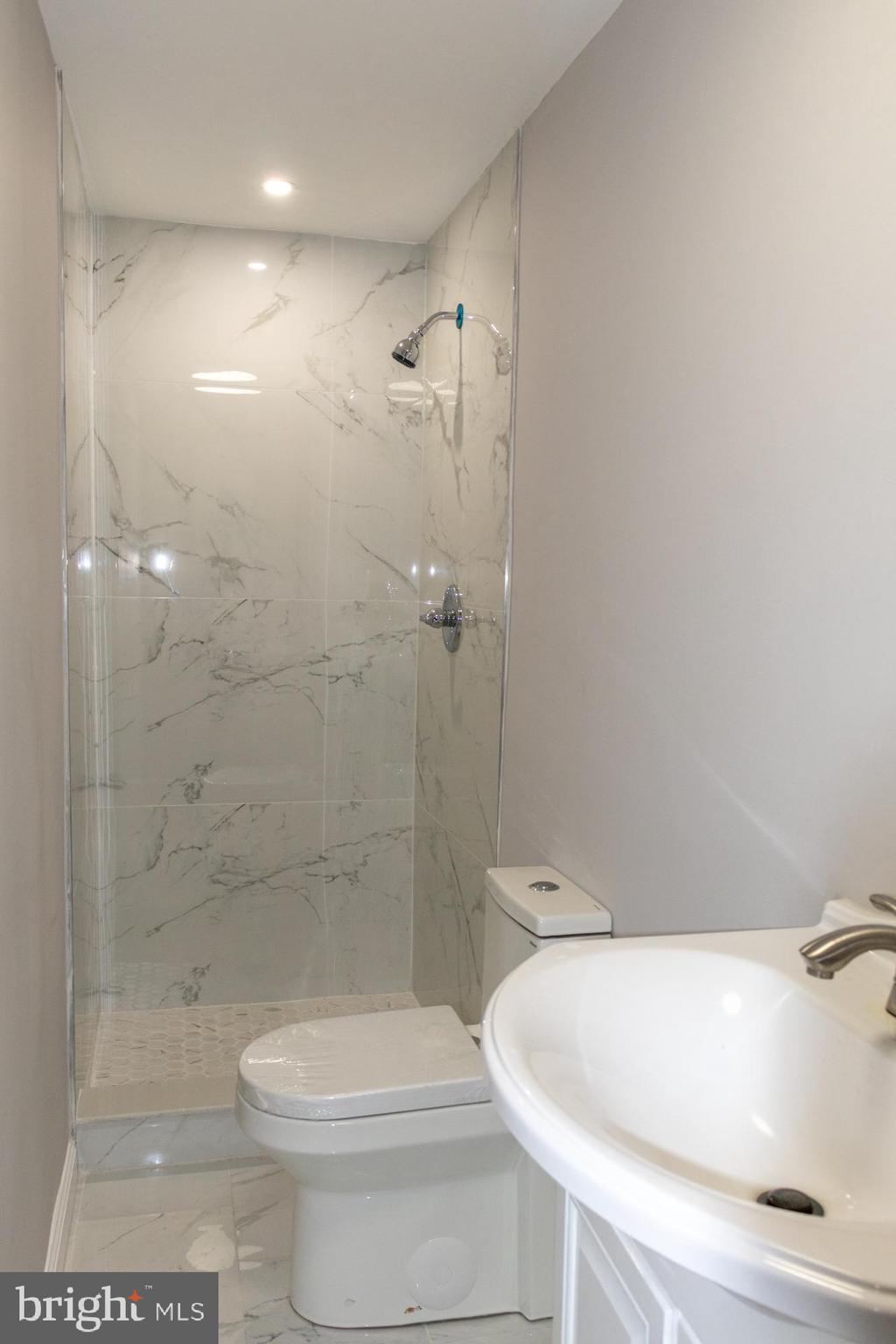 26 Byron Avenue Hamilton, NJ 08610 - Photo 31 of 33 a bathroom with a toilet and shower