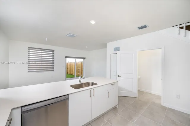 a view of a kitchen with electric appliances