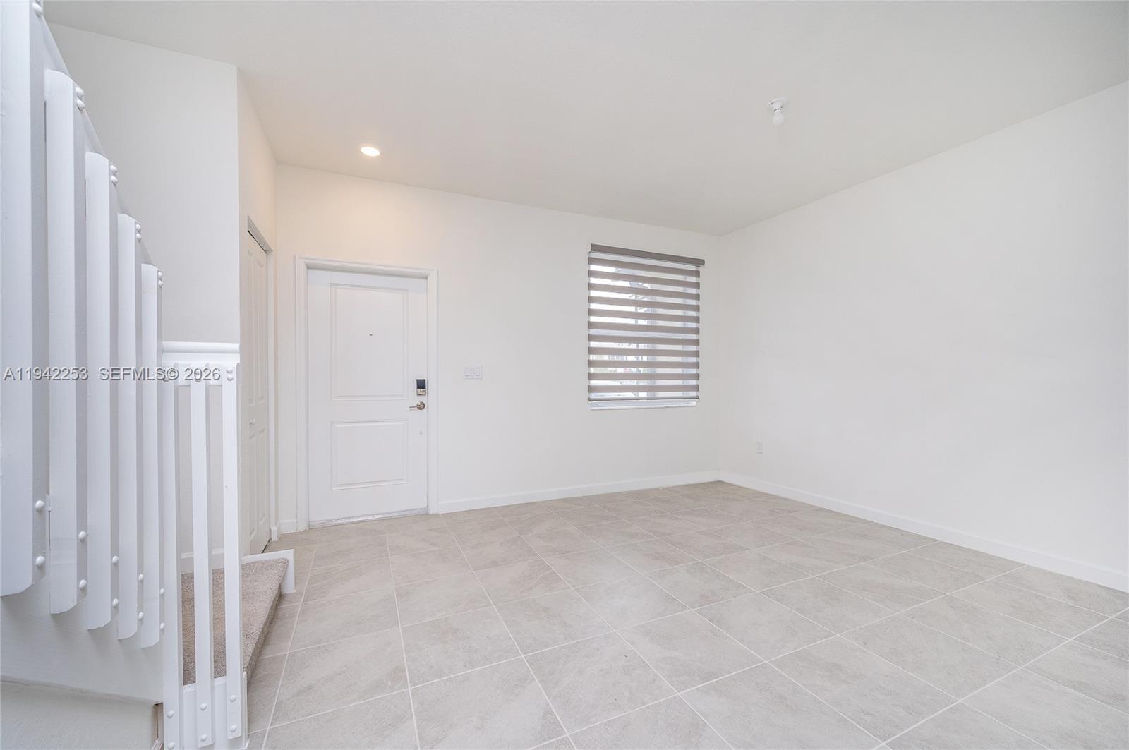 2747 Southeast 26th Road, Unit 2747 Homestead, FL 33035 - Photo 14 of 27 an empty room with windows