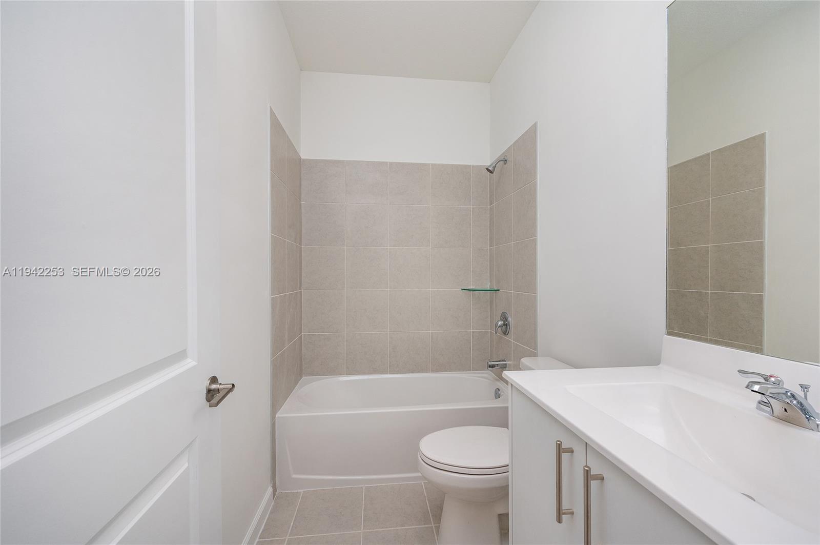 2747 Southeast 26th Road, Unit 2747 Homestead, FL 33035 - Photo 16 of 27 a bathroom with a sink a toilet and shower