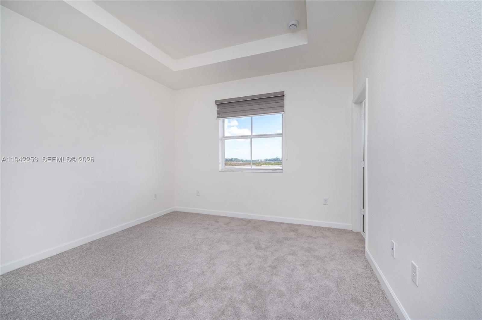 2747 Southeast 26th Road, Unit 2747 Homestead, FL 33035 - Photo 19 of 27 an empty room with a window