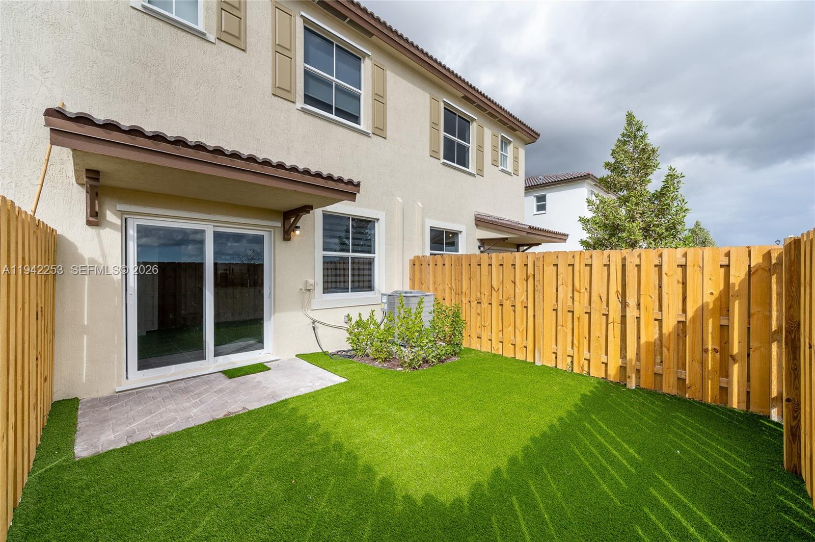 2747 Southeast 26th Road, Unit 2747 Homestead, FL 33035 - Photo 2 of 27 a view of a house with backyard and porch