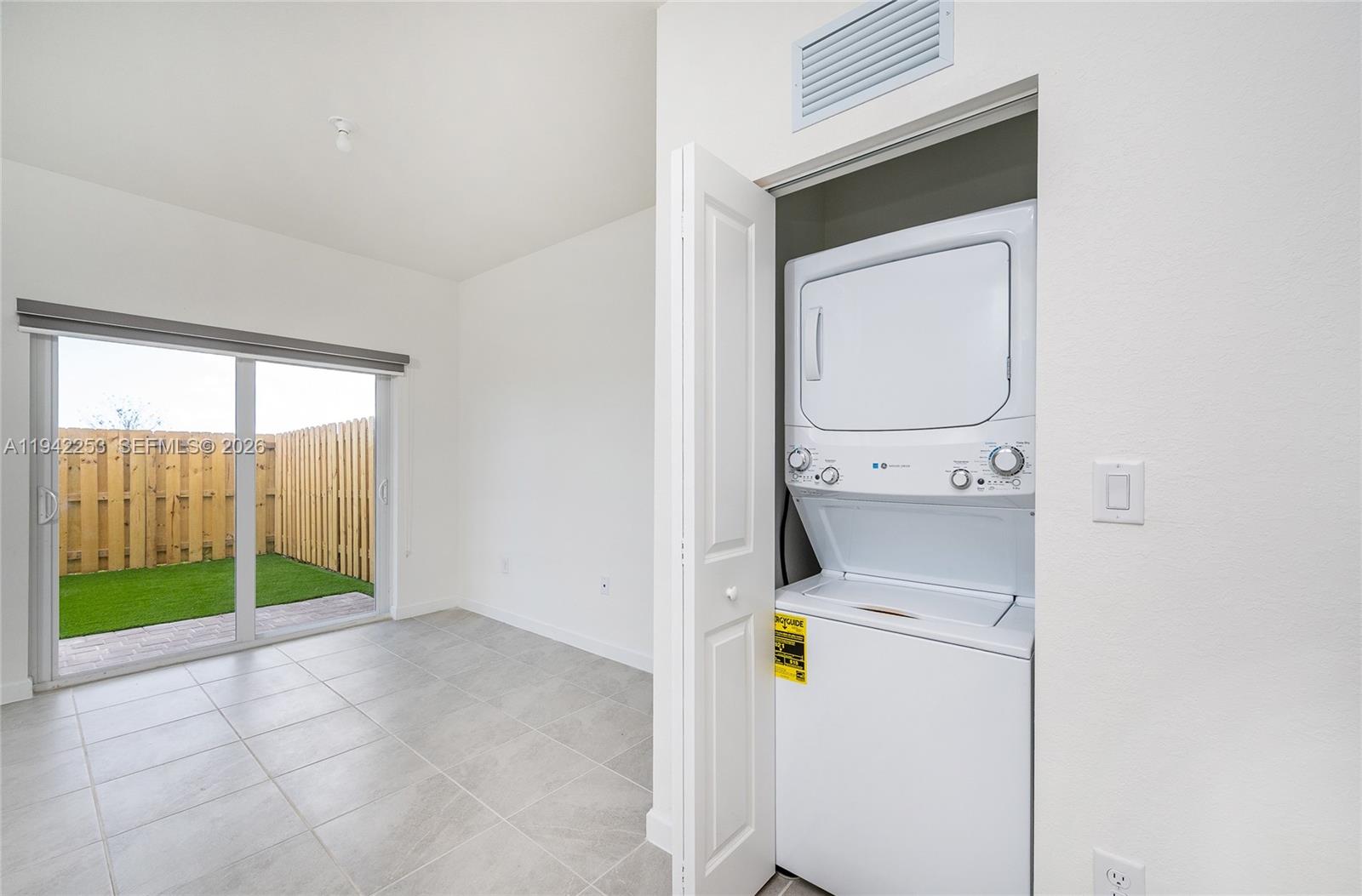 2747 Southeast 26th Road, Unit 2747 Homestead, FL 33035 - Photo 21 of 27 a view of storage and utility room with washer and dryer