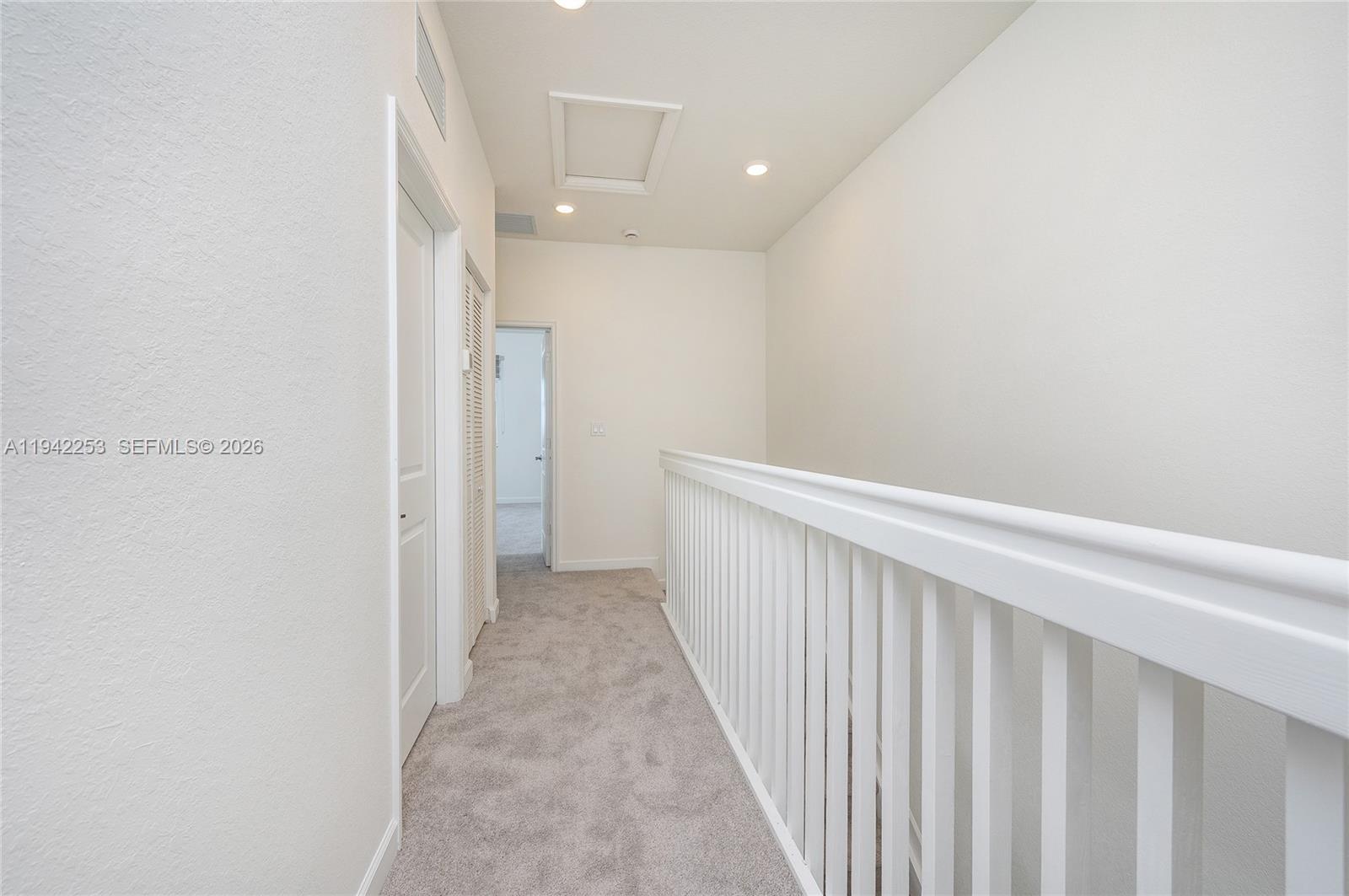 2747 Southeast 26th Road, Unit 2747 Homestead, FL 33035 - Photo 22 of 27 a view of a hallway with wooden floor
