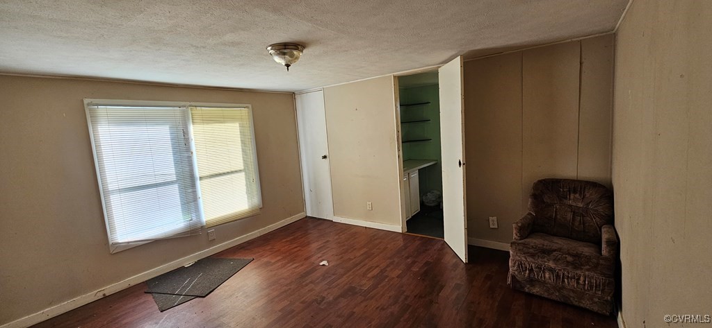 2718 Germantown Road Keysville, VA 23947 - Photo 8 of 16 Unfurnished room with wood finished floors and a t