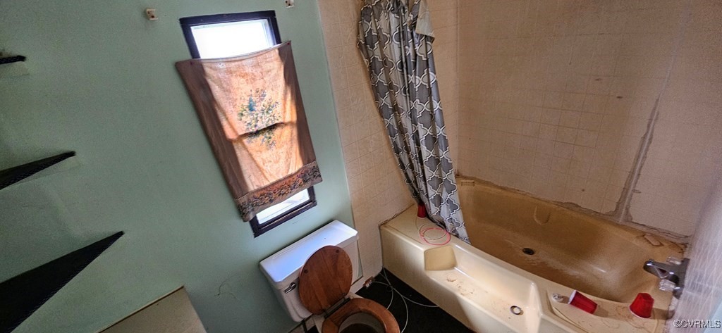 2718 Germantown Road Keysville, VA 23947 - Photo 10 of 16 Bathroom featuring toilet and shower / bath combo