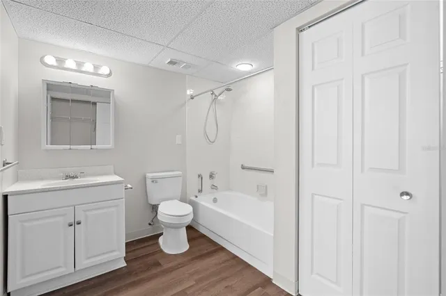 a bathroom with a toilet sink and a mirror