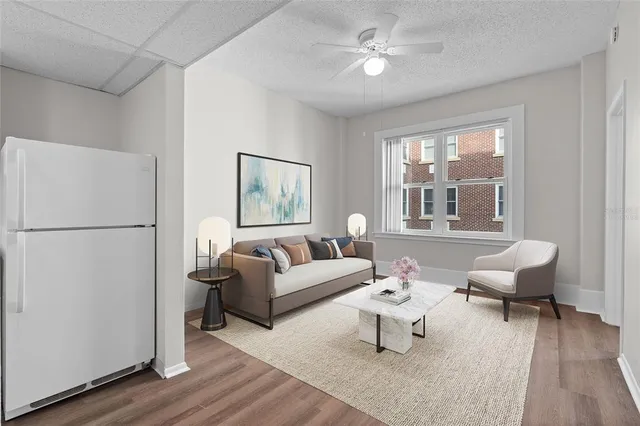 a living room with furniture and a window