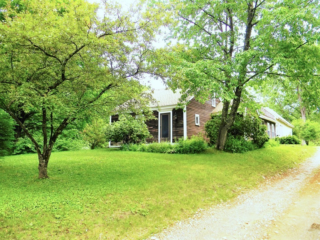 18 Flat Rock Road Petersham, MA 01366 - Photo 1 of 26 a front view of a house with garden