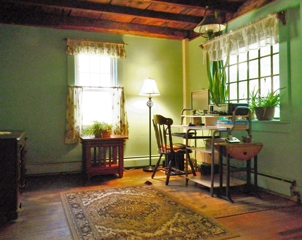 18 Flat Rock Road Petersham, MA 01366 - Photo 12 of 26 a view of a dining room with furniture and a window