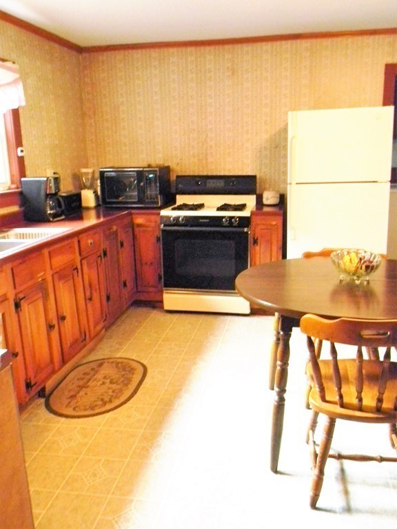 18 Flat Rock Road Petersham, MA 01366 - Photo 13 of 26 a kitchen with stainless steel appliances granite countertop a stove a sink and a microwave