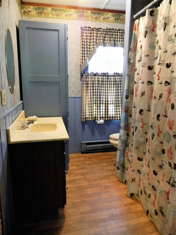 18 Flat Rock Road Petersham, MA 01366 - Photo 16 of 26 a bathroom with a sink and a mirror