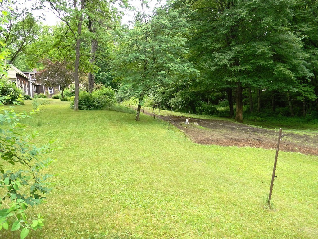 18 Flat Rock Road Petersham, MA 01366 - Photo 22 of 26 a view of a garden with a slide