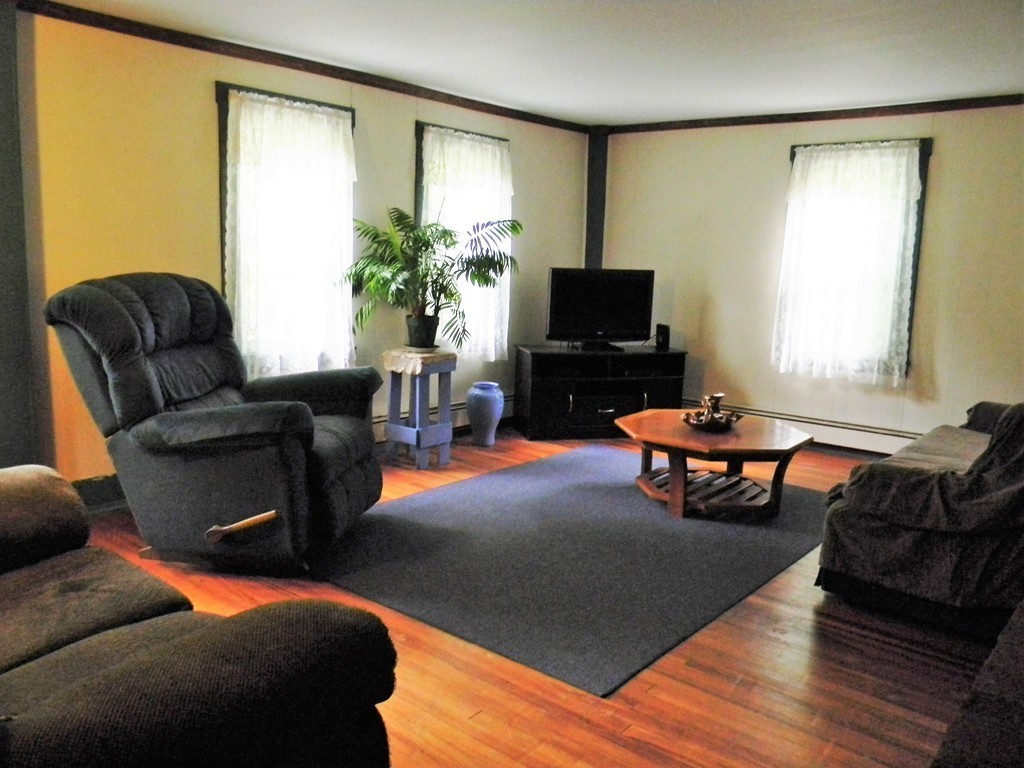 18 Flat Rock Road Petersham, MA 01366 - Photo 5 of 26 a living room with furniture and a flat screen tv