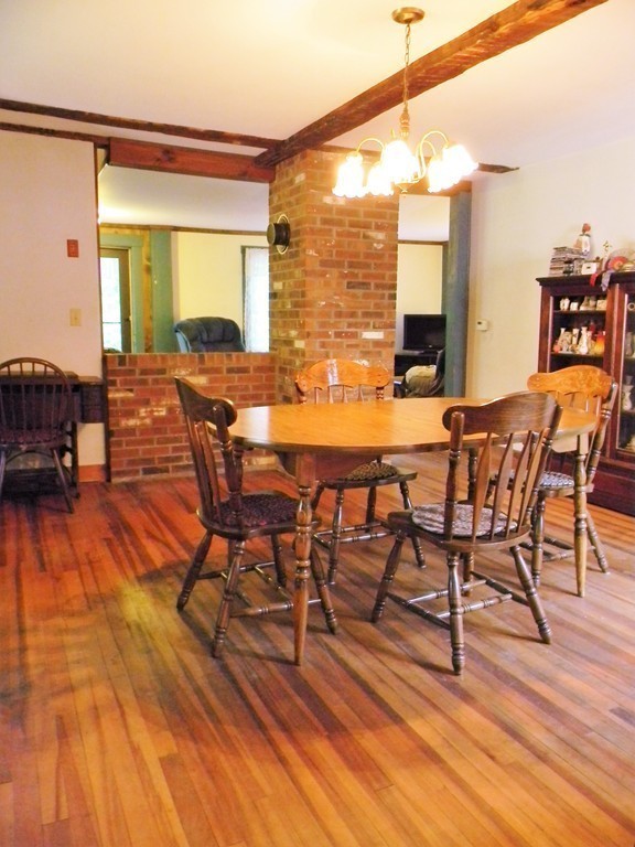 18 Flat Rock Road Petersham, MA 01366 - Photo 8 of 26 a dining room with furniture and wooden floor