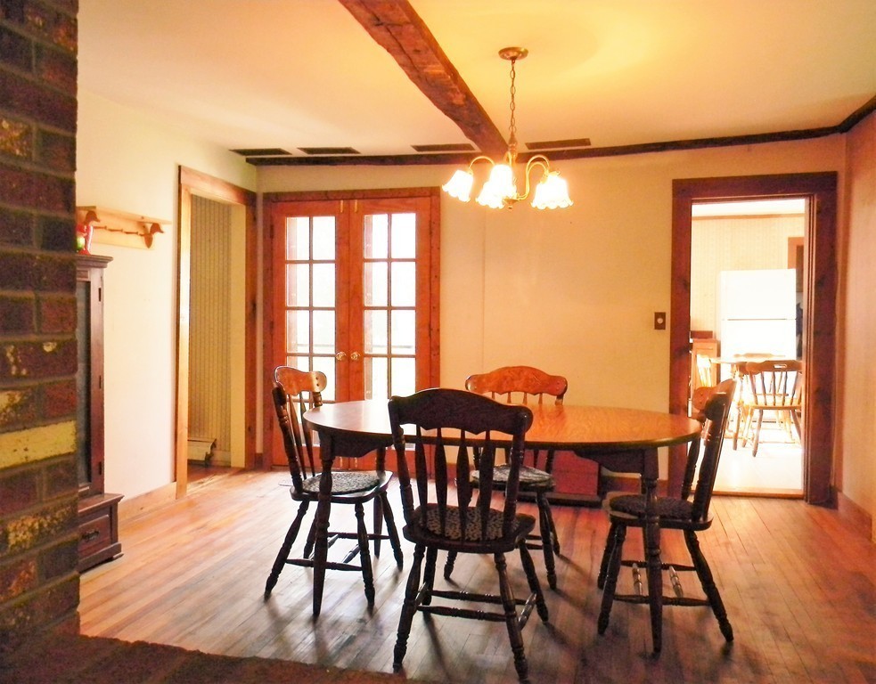 18 Flat Rock Road Petersham, MA 01366 - Photo 9 of 26 a view of a dining room with furniture window and wooden floor