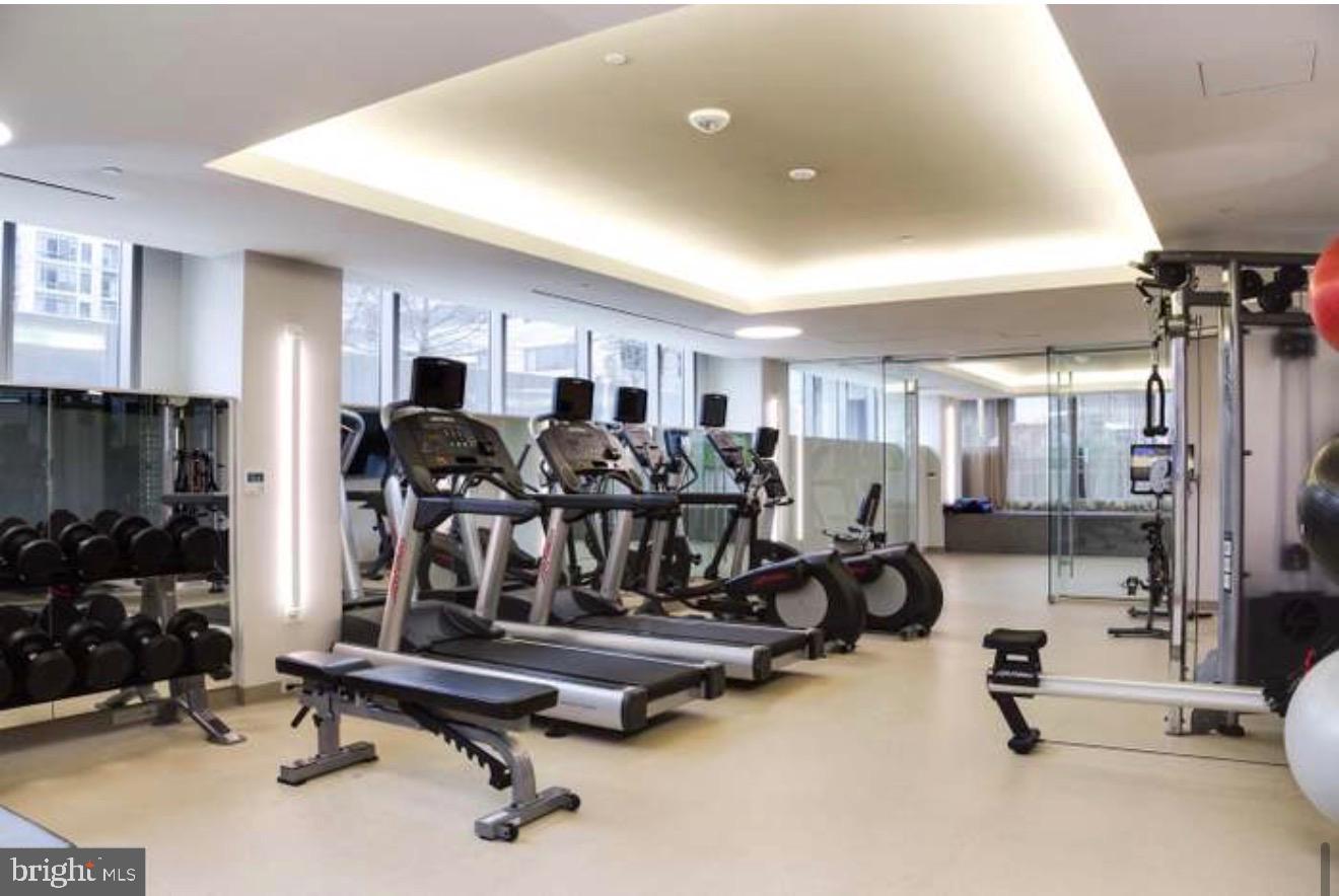 2501 M Street Northwest, Unit 722 Washington, DC 20037 - Photo 13 of 23 Modern fitness center with sleek equipment.