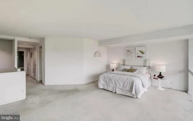 a bed room with a bed and a lamp