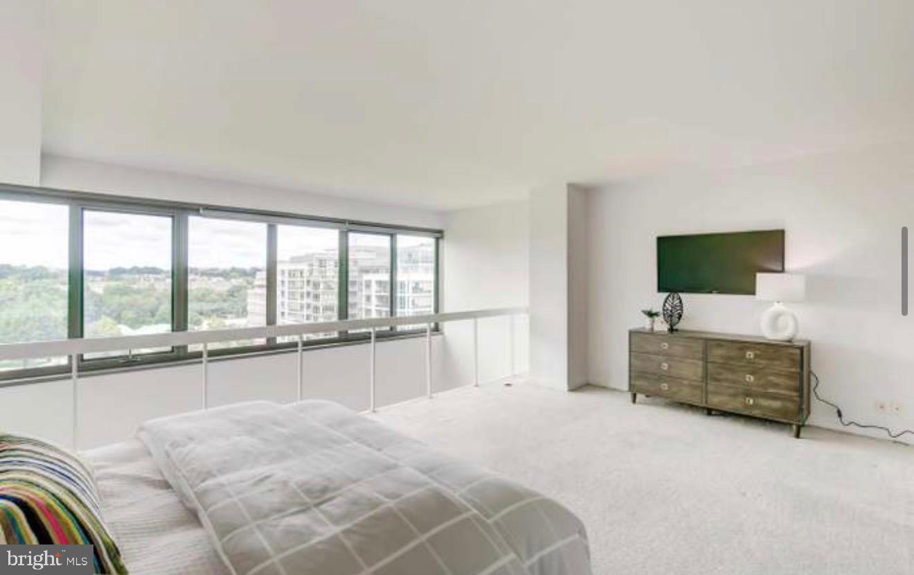 2501 M Street Northwest, Unit 722 Washington, DC 20037 - Photo 9 of 23 Spacious modern bedroom with scenic views.