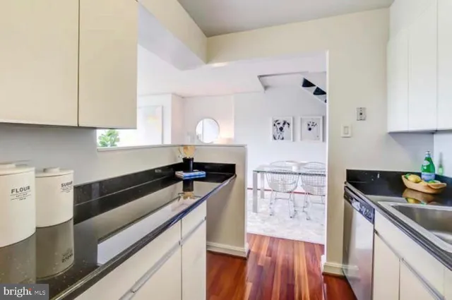 a kitchen with a sink and cabinets
