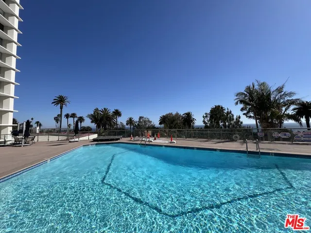 a view of a swimming pool and a yard