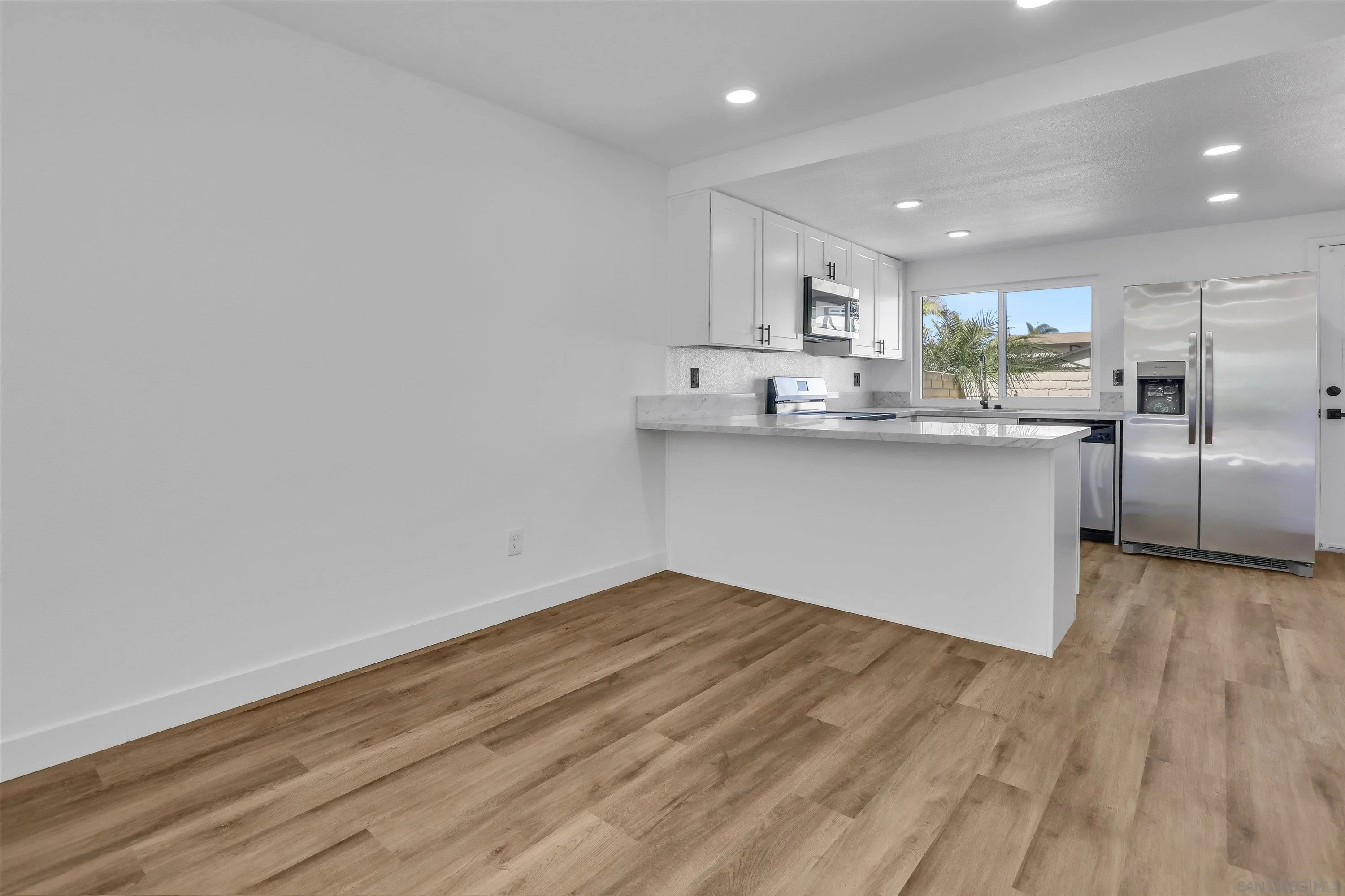 75 3rd Avenue, Unit 22 Chula Vista, CA 91910 - Photo 11 of 23 a kitchen with stainless steel appliances a refrigerator and a sink