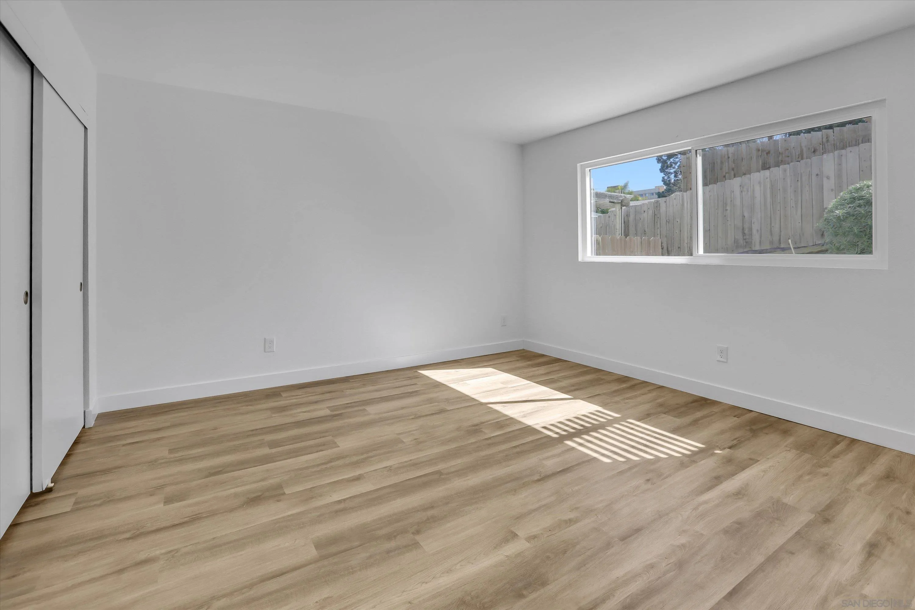 75 3rd Avenue, Unit 22 Chula Vista, CA 91910 - Photo 13 of 23 a view of empty room with wooden floor and fan