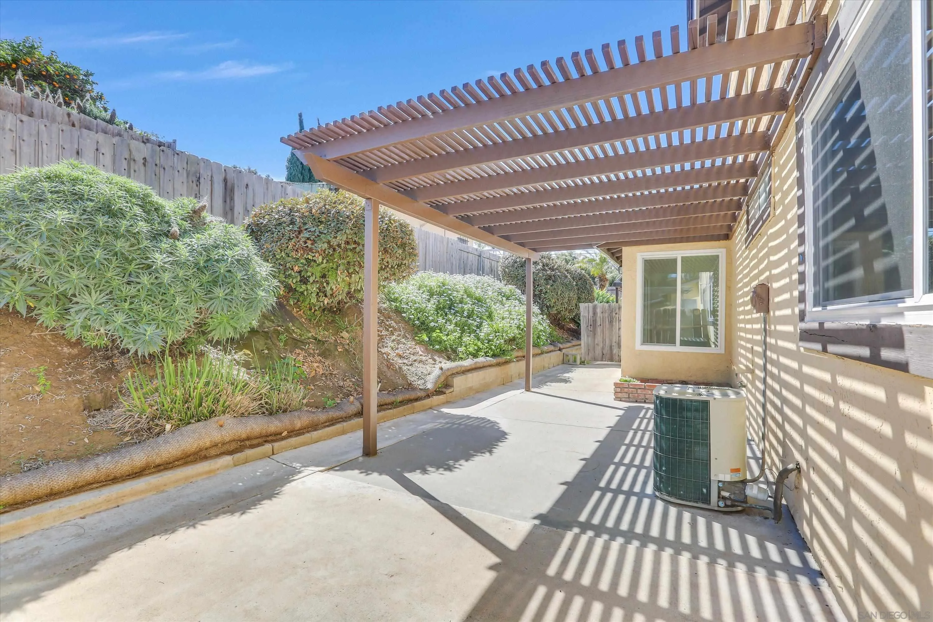 75 3rd Avenue, Unit 22 Chula Vista, CA 91910 - Photo 21 of 23 a view of a patio with table and chairs with wooden floor and fence