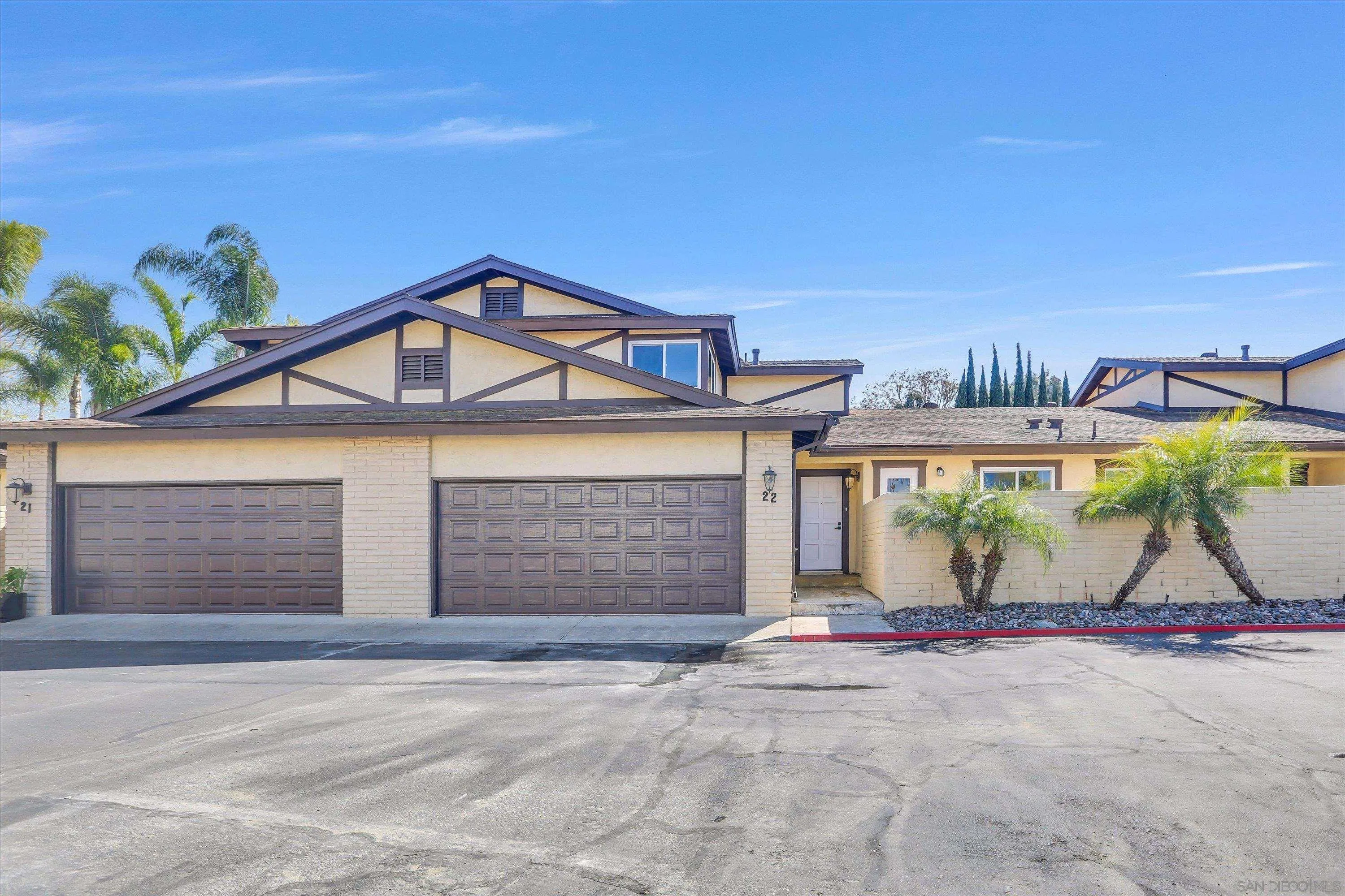75 3rd Avenue, Unit 22 Chula Vista, CA 91910 - Photo 4 of 23 a view of a house with a yard and garage