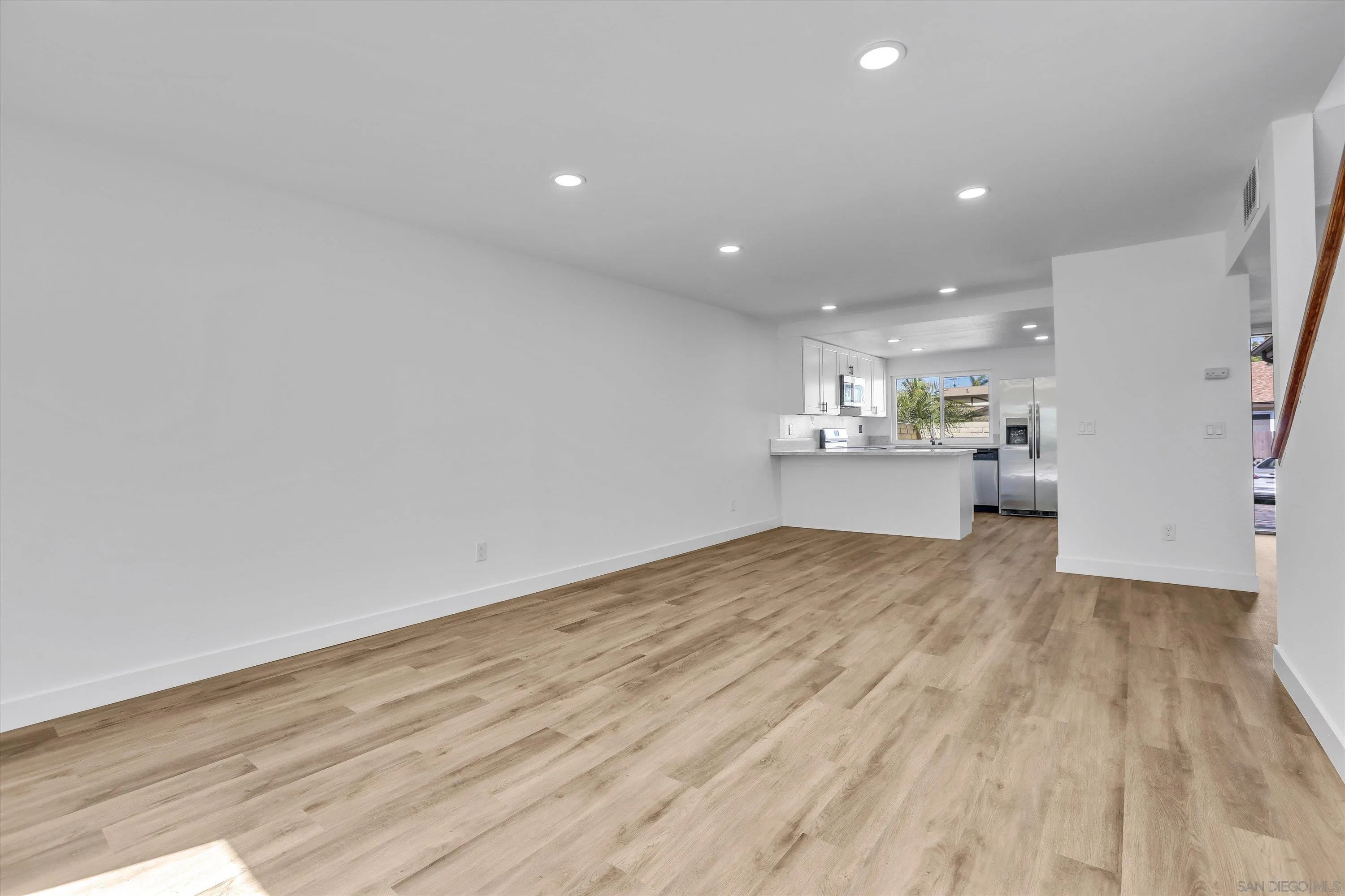75 3rd Avenue, Unit 22 Chula Vista, CA 91910 - Photo 10 of 23 a view of a kitchen with a sink and wooden floor
