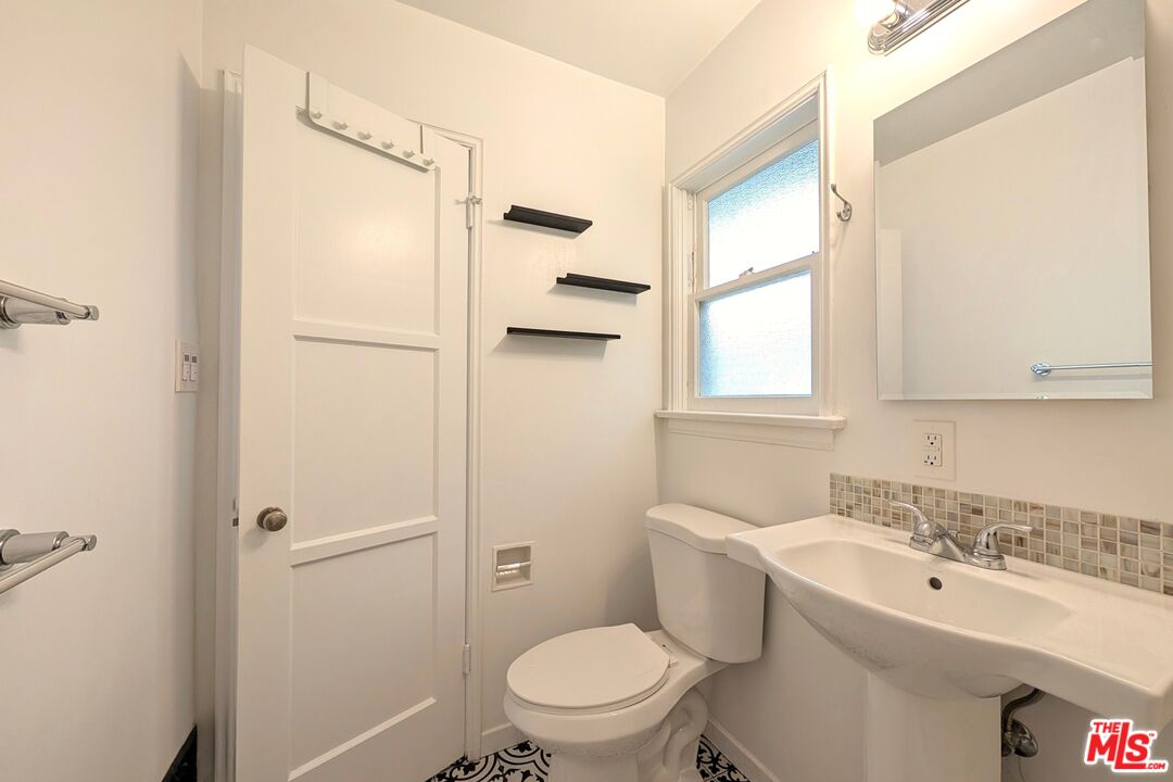 1030 5th Street, Unit C Santa Monica, CA 90403 - Photo 5 of 16 a bathroom with a sink toilet and shower