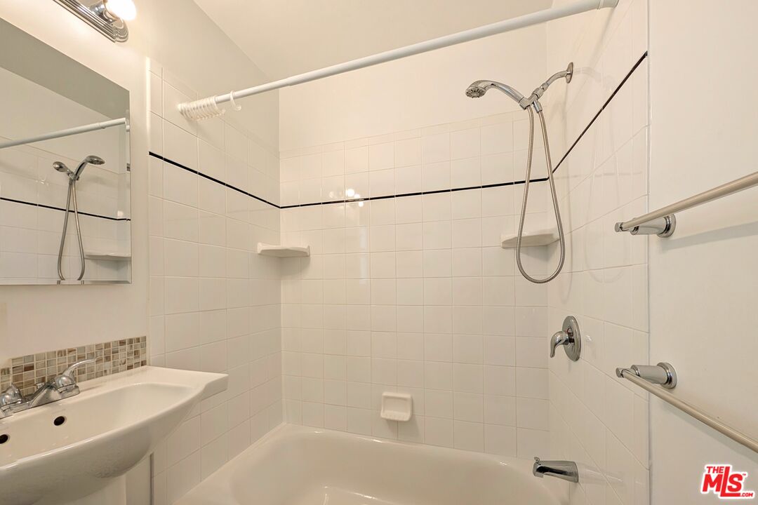 1030 5th Street, Unit C Santa Monica, CA 90403 - Photo 6 of 16 a bathroom with a bath tub with a shower