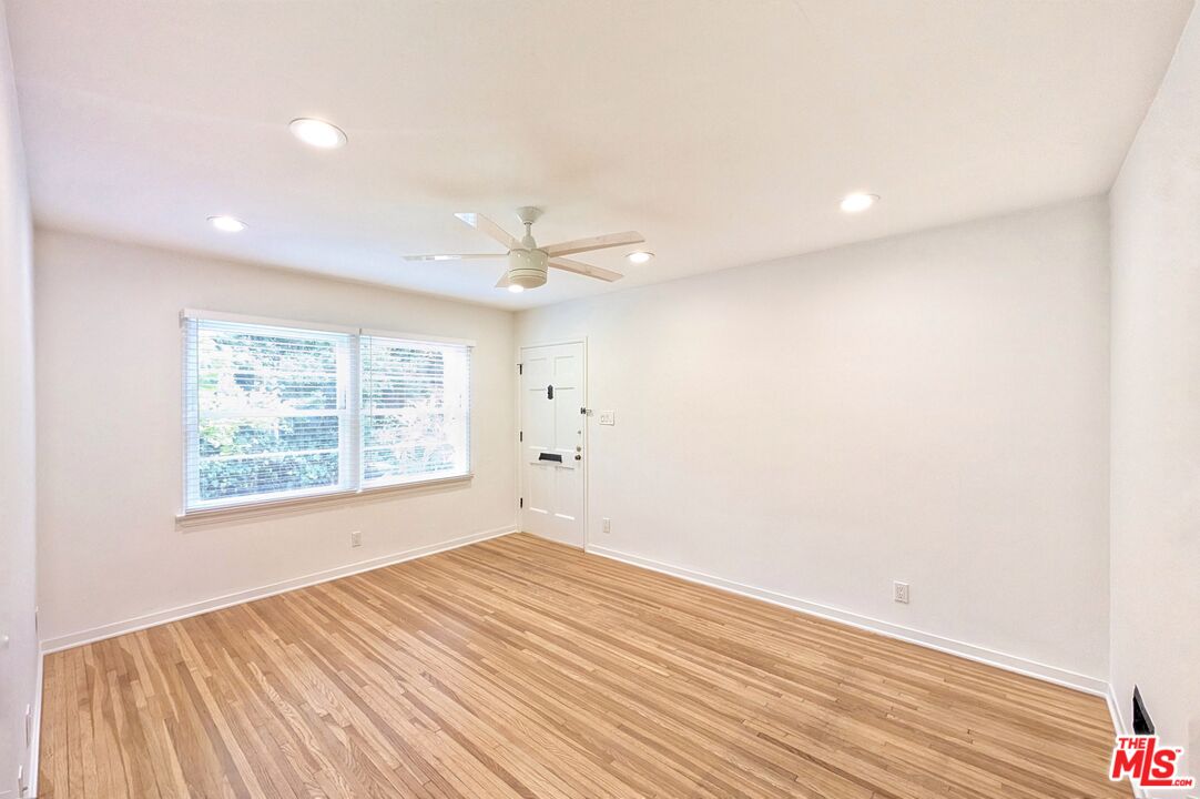 1030 5th Street, Unit C Santa Monica, CA 90403 - Photo 10 of 16 wooden floor in an empty room with a window