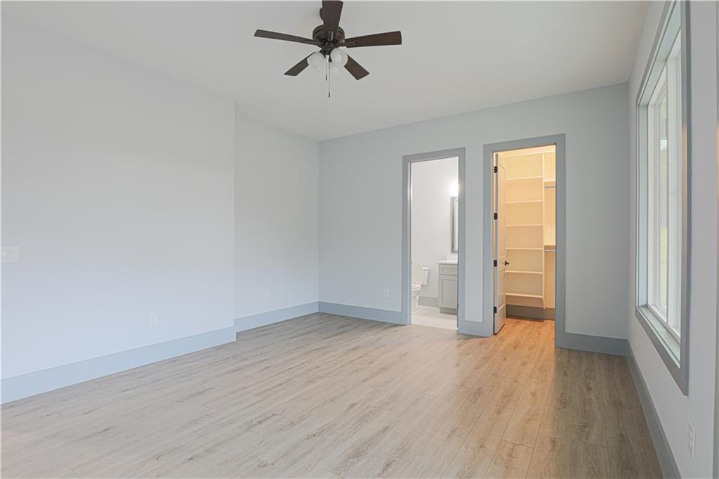 1341 Wheeler Creek Road Maysville, GA 30558 - Photo 23 of 51 a view of a room with wooden floor and white walls