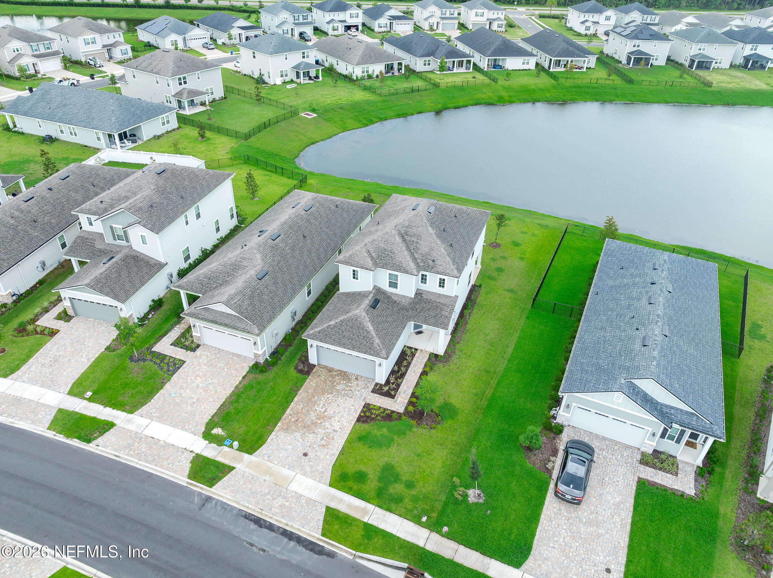 57 Cedar Elm Way St. Augustine, FL 32092 - Photo 46 of 65 an aerial view of a house with a garden and lake view